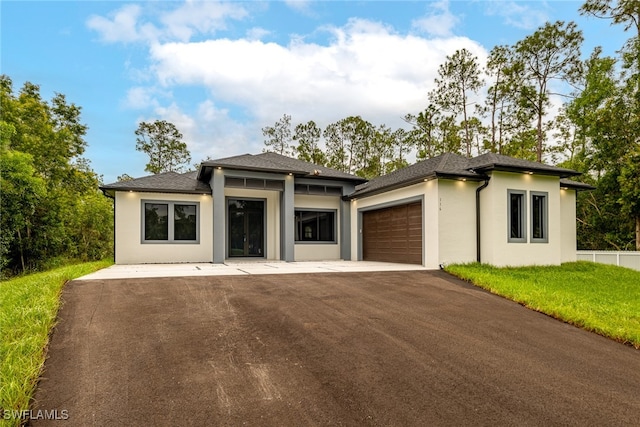 prairie-style home featuring a garage