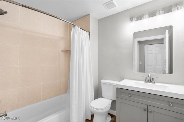 bathroom with toilet, visible vents, shower / bath combo with shower curtain, and vanity