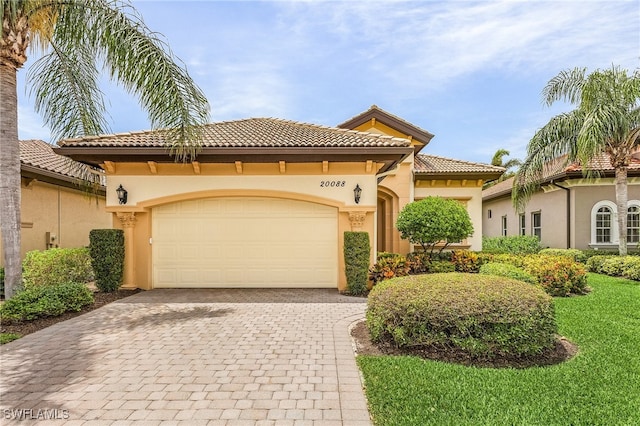 mediterranean / spanish-style home featuring a garage