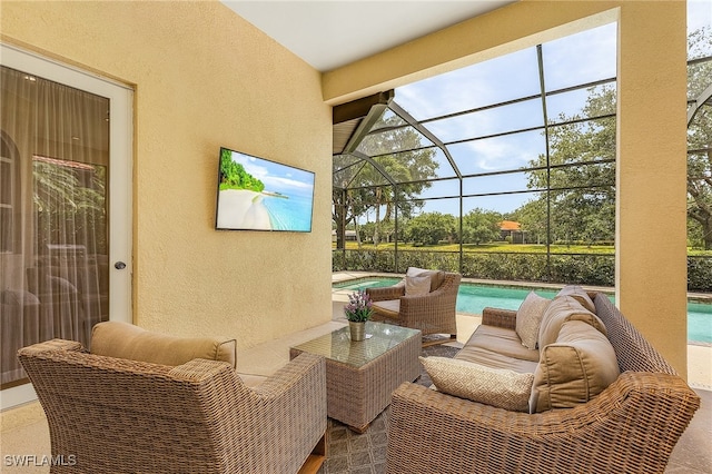 view of patio / terrace featuring outdoor lounge area and a lanai