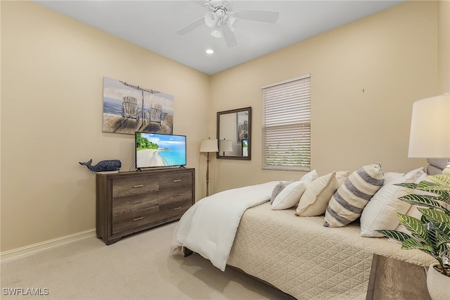 bedroom featuring ceiling fan and light colored carpet