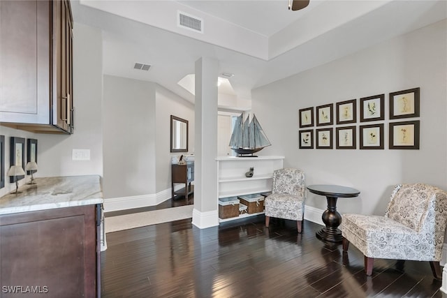 sitting room featuring dark hardwood / wood-style flooring