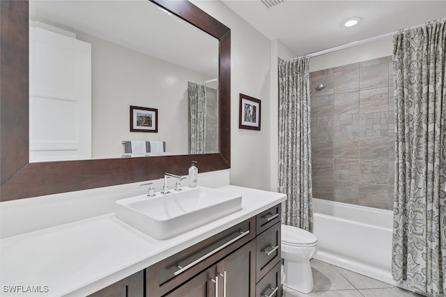 full bathroom featuring tile patterned floors, vanity, shower / bath combo, and toilet