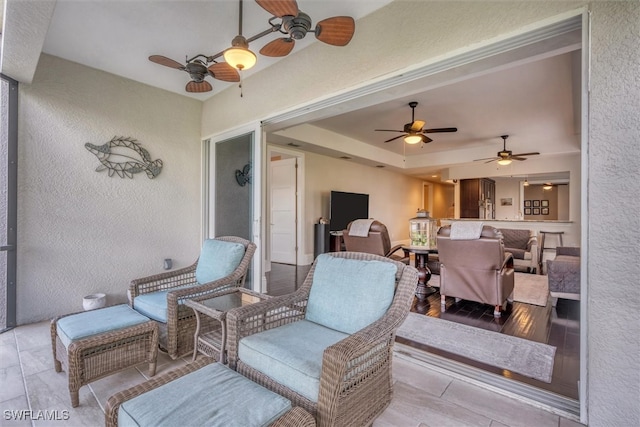 interior space with ceiling fan and outdoor lounge area