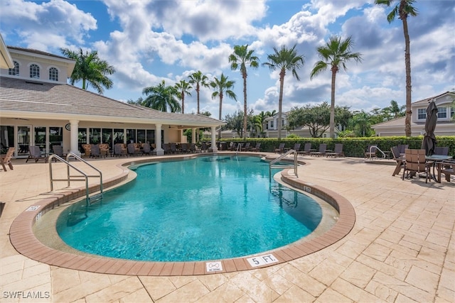 view of pool featuring a patio