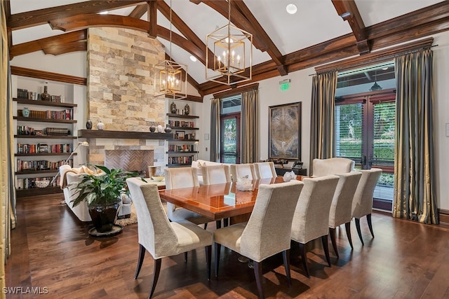 dining area with dark hardwood / wood-style flooring, a fireplace, a notable chandelier, and beam ceiling