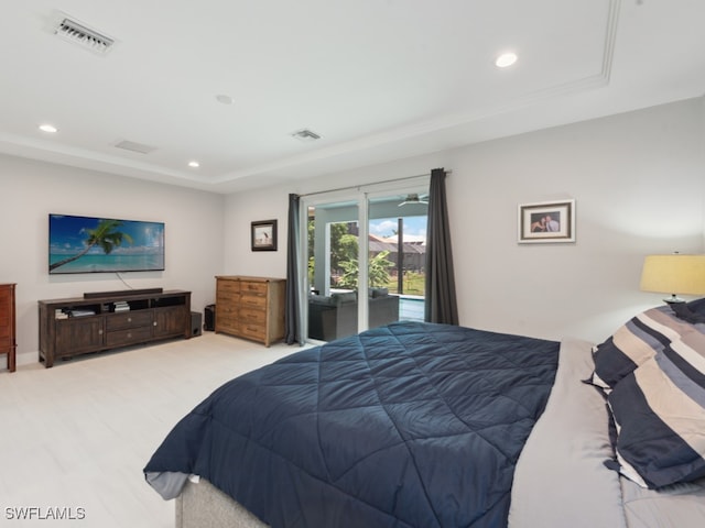 bedroom with access to outside and light hardwood / wood-style flooring