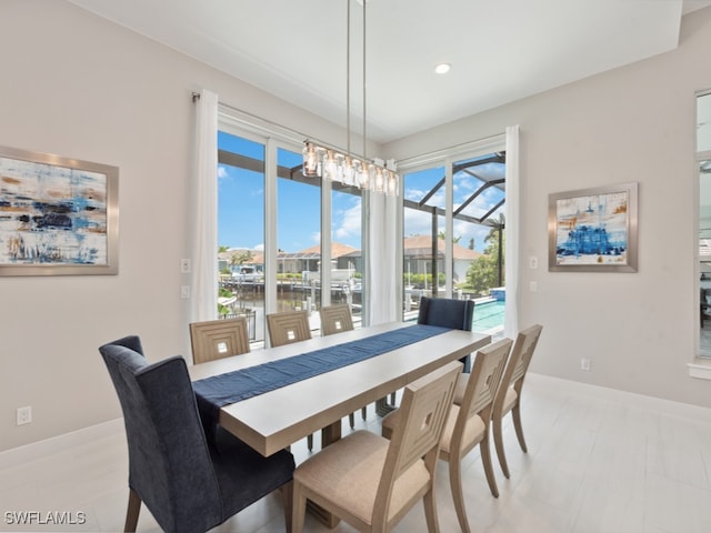 dining space featuring an inviting chandelier