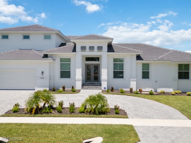 view of front of property featuring a garage and a front yard