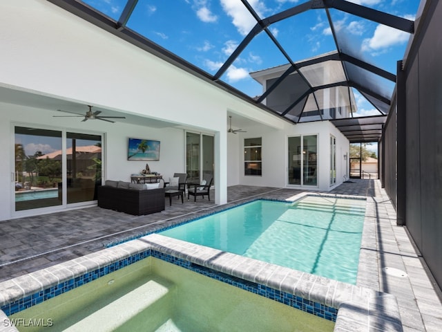 view of pool featuring ceiling fan, glass enclosure, a patio area, and an outdoor hangout area