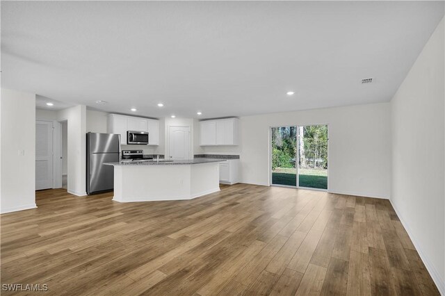 interior space with sink and light hardwood / wood-style floors