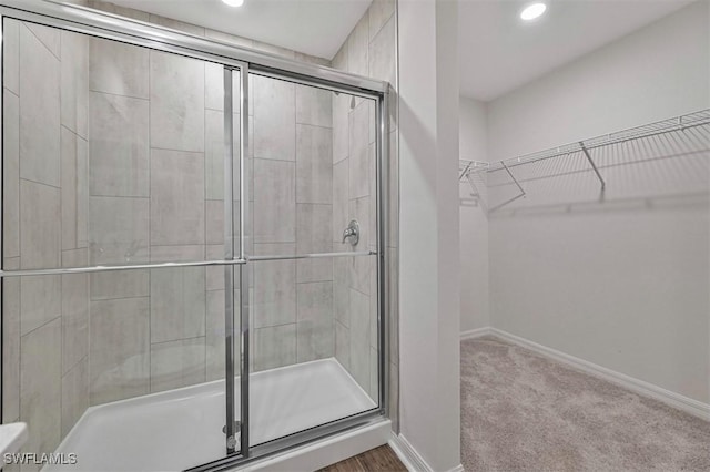 2701 NW 21st Ter, Cape Coral, FL 33993 - full bathroom featuring a shower stall, baseboards, recessed lighting, and a walk in closet