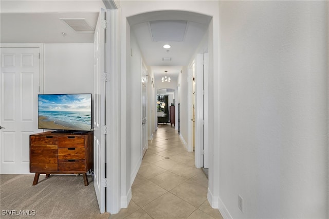 hallway with light tile patterned flooring