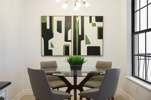 dining space featuring a chandelier