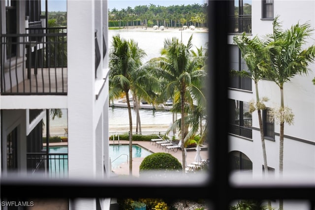 details featuring a water view and a pool