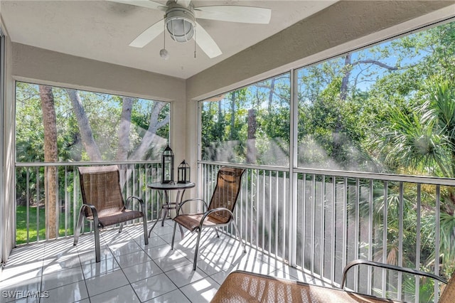 sunroom with ceiling fan and a healthy amount of sunlight