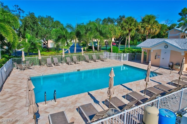 737 Wiggins Lake Dr Unit 201, Naples, FL 34110 - community pool with a patio