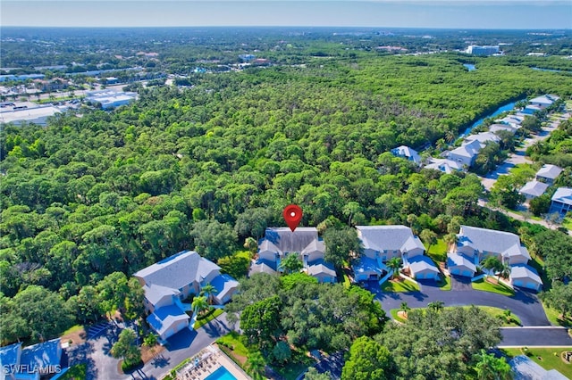 737 Wiggins Lake Dr Unit 201, Naples, FL 34110 - aerial view of residential area with a heavily wooded area