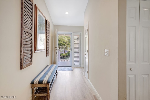 hall with light hardwood / wood-style flooring