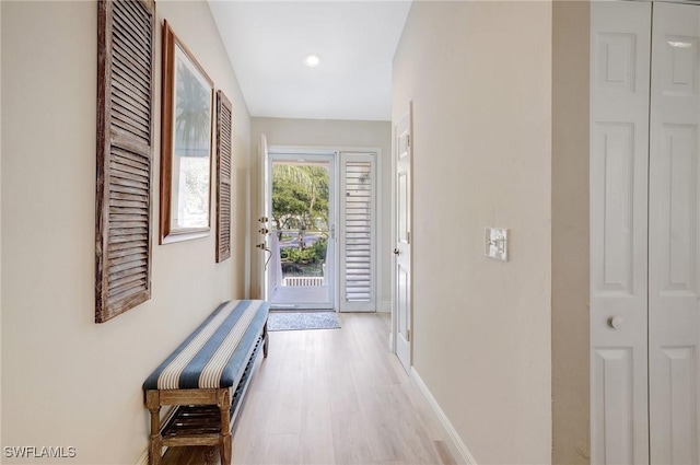 737 Wiggins Lake Dr Unit 201, Naples, FL 34110 - doorway with light wood finished floors, baseboards, and recessed lighting