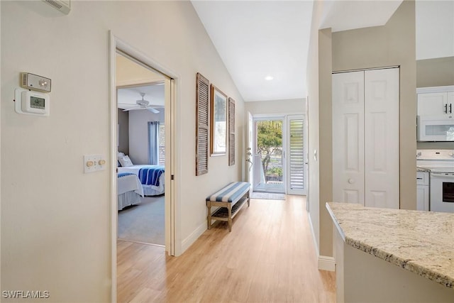 737 Wiggins Lake Dr Unit 201, Naples, FL 34110 - corridor featuring light wood-style floors and baseboards