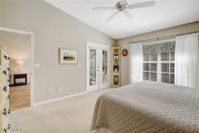 bedroom featuring access to exterior, light colored carpet, vaulted ceiling, and ceiling fan