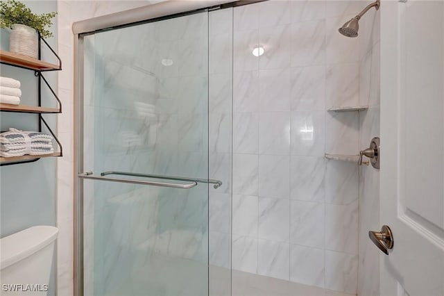 737 Wiggins Lake Dr Unit 201, Naples, FL 34110 - full bathroom with toilet and a shower stall