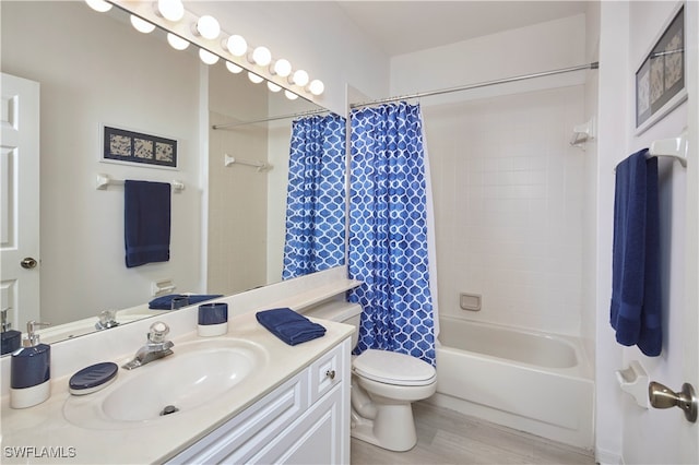 full bathroom featuring vanity, shower / bath combo, wood-type flooring, and toilet