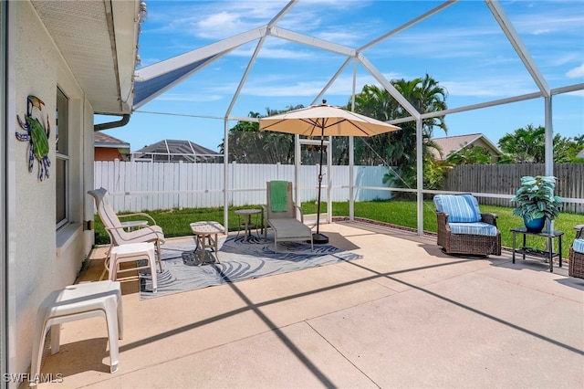 view of patio / terrace featuring a lanai