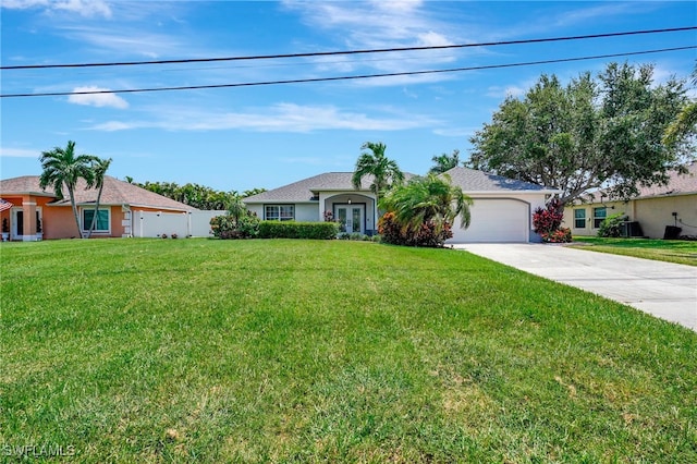 ranch-style house with a garage and a front lawn