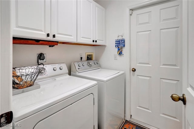 laundry area featuring cabinets and washer and dryer