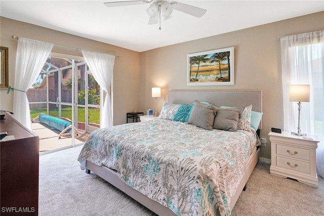 carpeted bedroom with ceiling fan and access to outside