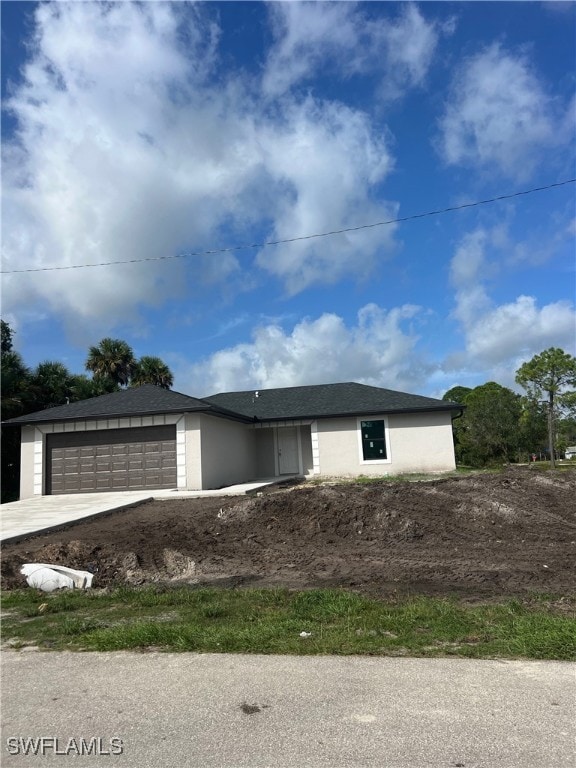 view of front of property with a garage