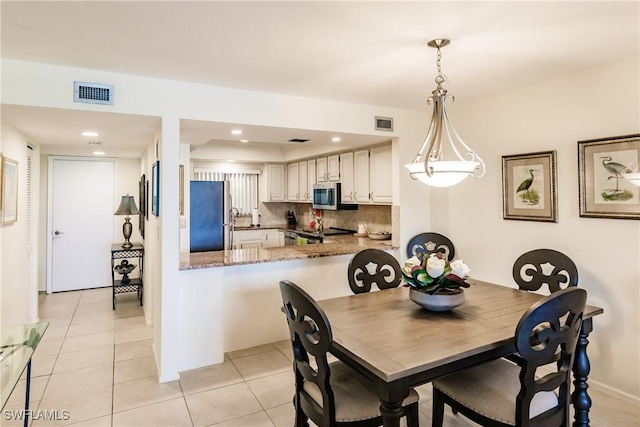 4210 Steamboat Bnd Unit 405, Fort Myers, FL 33919 - dining space with light tile patterned floors and recessed lighting