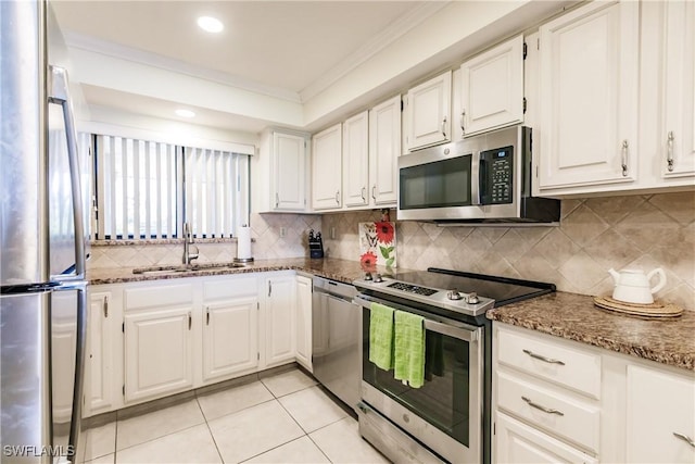 4210 Steamboat Bnd Unit 405, Fort Myers, FL 33919 - kitchen featuring appliances with stainless steel finishes, a sink, ornamental molding, white cabinets, and recessed lighting