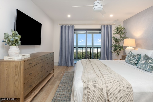 bedroom featuring access to exterior, ceiling fan, and light hardwood / wood-style floors