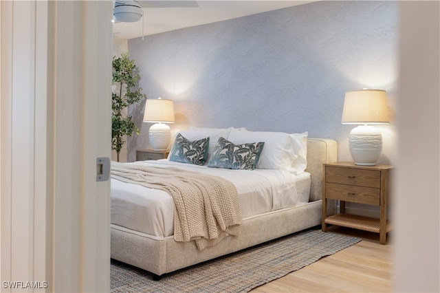 bedroom featuring ceiling fan and light hardwood / wood-style floors