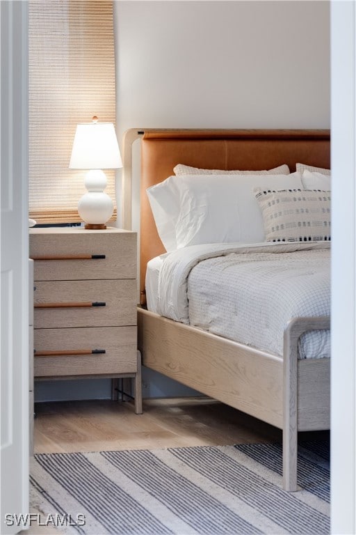 bedroom featuring wood-type flooring