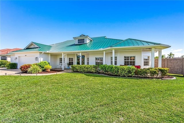 view of front of home with a garage and a front yard