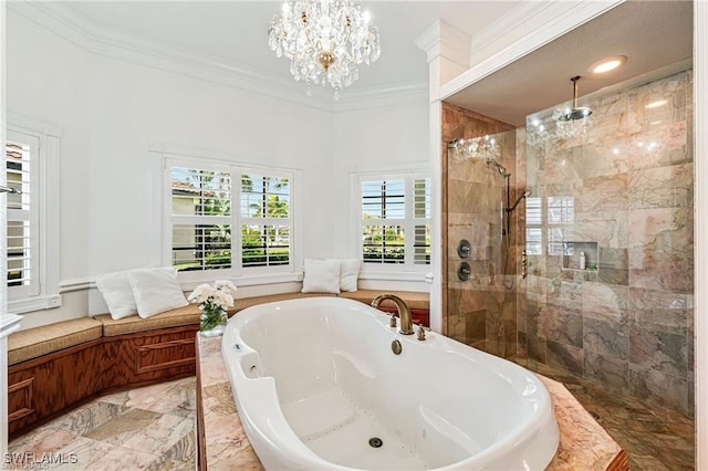 bathroom with separate shower and tub, an inviting chandelier, and ornamental molding