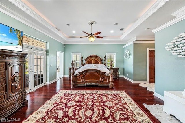 bedroom featuring access to exterior, a raised ceiling, ornamental molding, and dark wood-type flooring