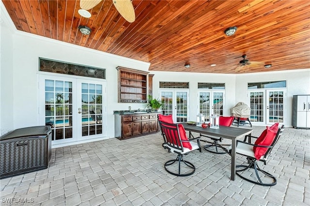 view of patio / terrace featuring ceiling fan and french doors