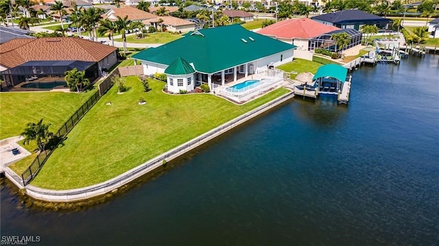 birds eye view of property with a water view