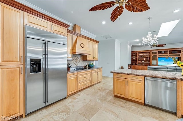 kitchen featuring light brown cabinets, ornamental molding, custom range hood, and appliances with stainless steel finishes