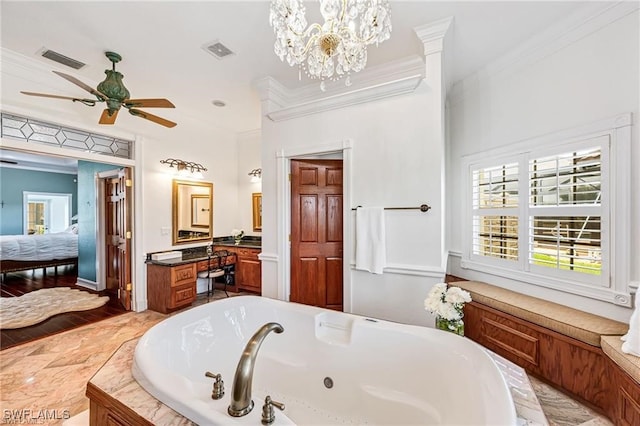 bathroom featuring vanity, ceiling fan with notable chandelier, crown molding, and a bathing tub