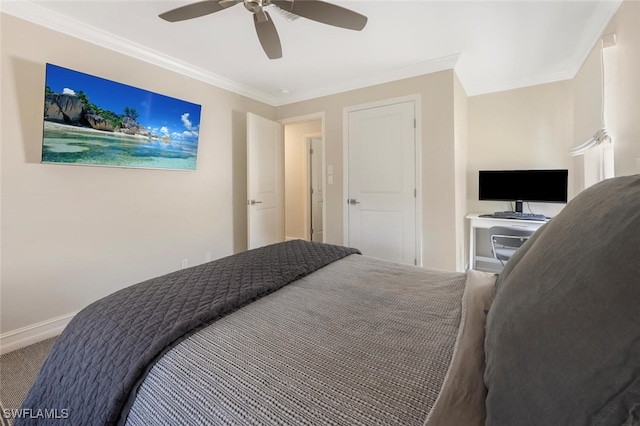 carpeted bedroom with ornamental molding and ceiling fan