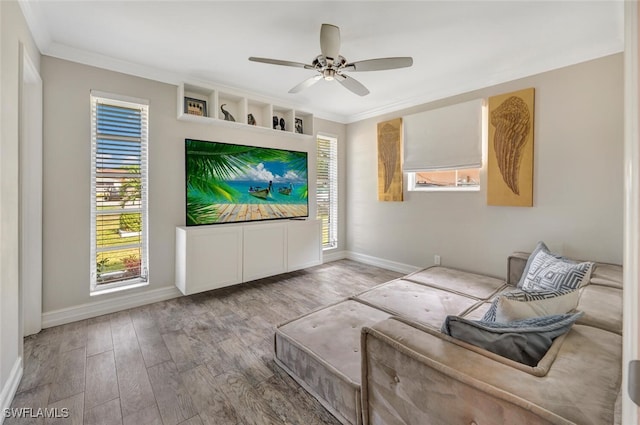 sitting room with crown molding, ceiling fan, and light hardwood / wood-style floors