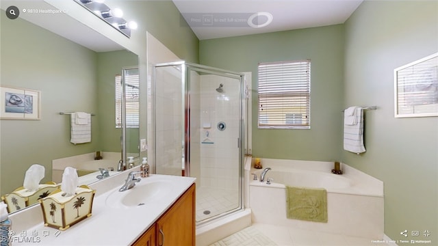 bathroom with vanity and plus walk in shower