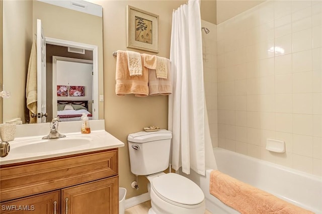 full bathroom featuring vanity, toilet, and shower / bath combo with shower curtain