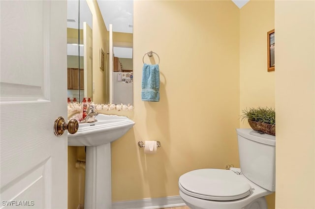 bathroom featuring toilet